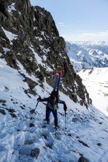 Ski tourers on the ascent in a saddle
