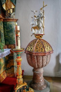 Baptismal font with candle