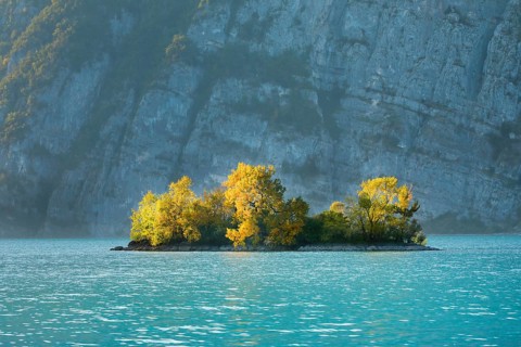 Small chive island in the turquoise waters of Lake Walen