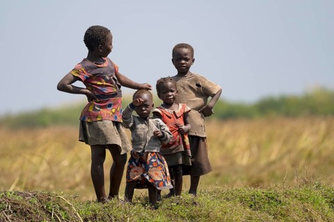 Children watching tourists