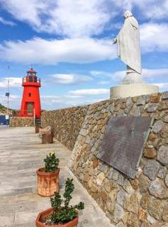 Memorial Monument with memorial plaque on the right for victims of sinking of cruise ship Ship sinking disaster Ship disaster Costa Concordia