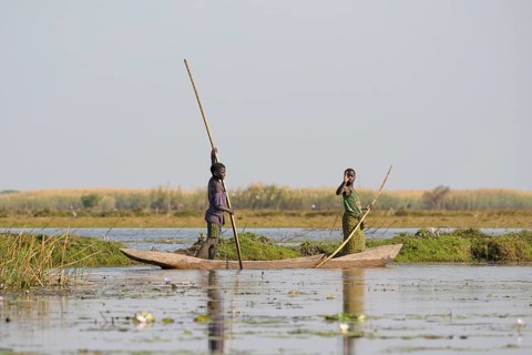 Local children in canoe