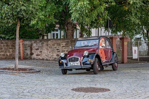 Vintage car Citroen 2CV in motion
