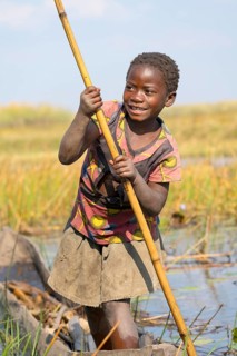 Smiling girl on canoe