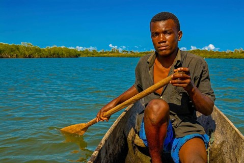 Man paddling through the mangroves of the Island Ile Sainte-Marie although Nosy Boraha