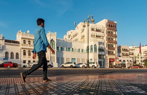 Man walks on sidewalk