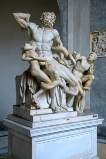 View from half left on historical sculpture in marble Marble sculpture by ancient sculptor Laocoon Group of priest Laocoon and sons fighting battle with snake