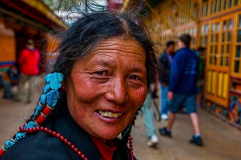 Old tibetan pilgrim in the Drepung temple