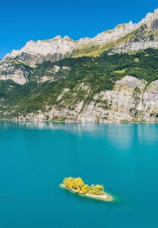 Aerial view of Lake Walen with a view of Chive Island in the turquoise water and mountains with Leistchamm in the background