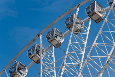 Gondolas of a Ferris wheel at the harbour