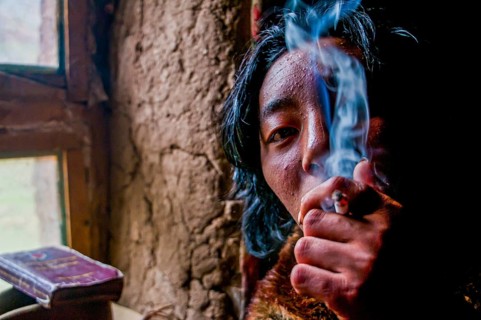 Monk smoking in a monastery