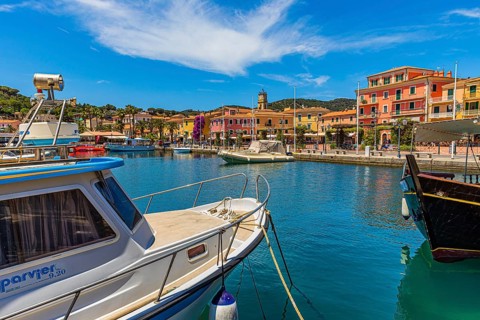 Boats anchor in the harbour of Porto Azzurro
