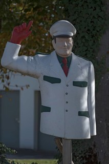 Figure of a traffic policeman in front of a play street