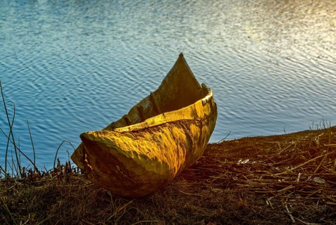 Wooden canoe at sunset