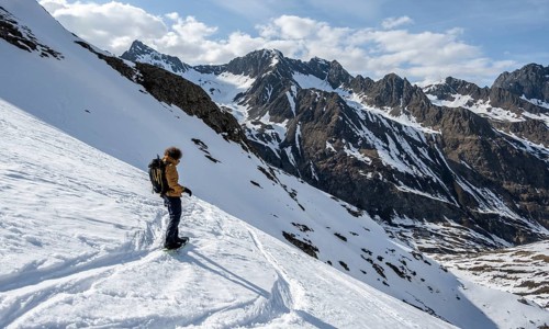 Snowboarders in the mountains in winter