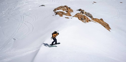 Splitboarder jumps
