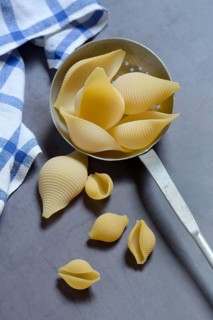Conchiglione and small conchiglie with sieve ladle