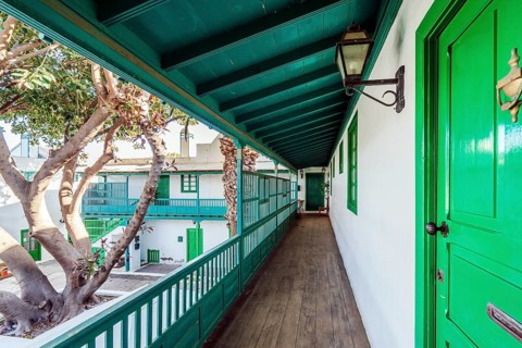 Picturesque white and green settlement called Pueblo Marinero designed by Cesar Manrique located in Costa Teguise