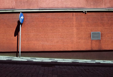 Empty street with blue road sign