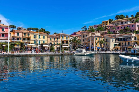 Boats anchor in the harbour of Porto Azzurro