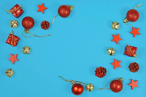 Christmas flat lay with red ornaments in shape of tree baubles