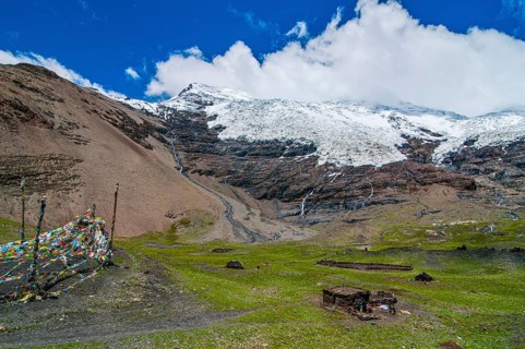 Hut below a glacier on the Karo-La Pass along the Freindship Highway