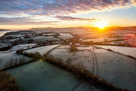 Sunrise over Fields and River Teign from a drone