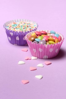 Chocolate lentils and love beads in paper moulds