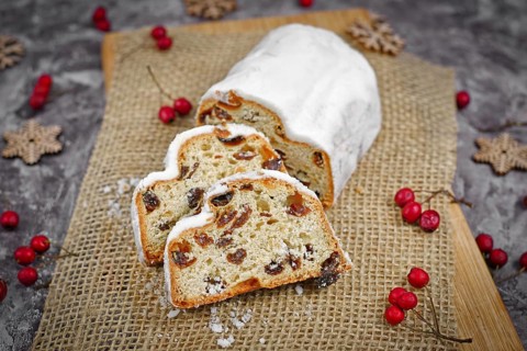 Slices of traditional German christmas season sweet food called Stollen or Christstollen