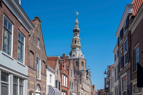 Town hall and historic house facades in Meelstraat