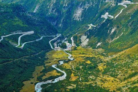View from the Rhone glacier of the glacial stream and the pass roads