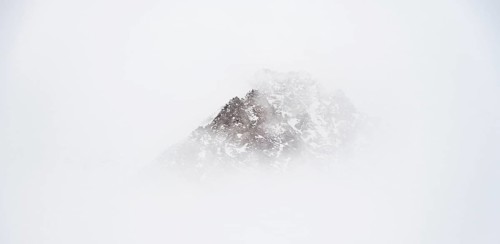 Mountains in winter with clouds and fog