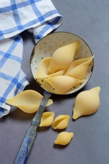 Conchiglione and small conchiglie with sieve ladle
