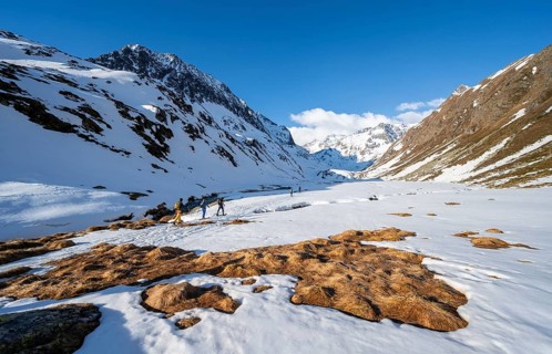 Ski tourers in a valley at Oberbergbach
