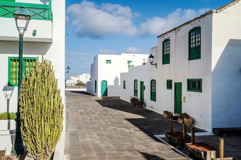 Picturesque white and green settlement called Pueblo Marinero designed by Cesar Manrique located in Costa Teguise
