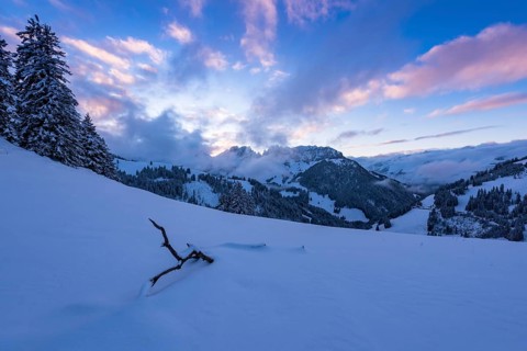 Winter landscape on the Jaun Pass with a view of the Gastlosen after sunset