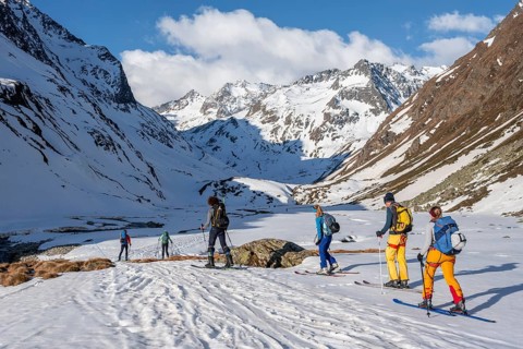 Ski tourers in winter in the mountains