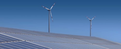 Solar plant with wind turbine in the background. Binsham