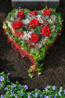 Grave with heart-shaped flower decoration