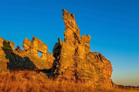 Savannah and huge rock formations at sunset in the Isalo National Park