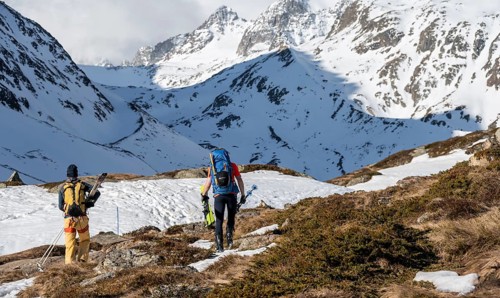 Ski tourers in winter in the mountains