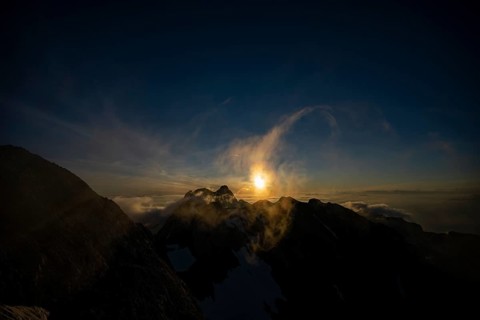 Altmann summit with yellow cloud wisps at sunrise