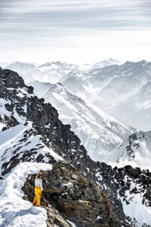 Mountaineer at the summit of the Sulzkogel