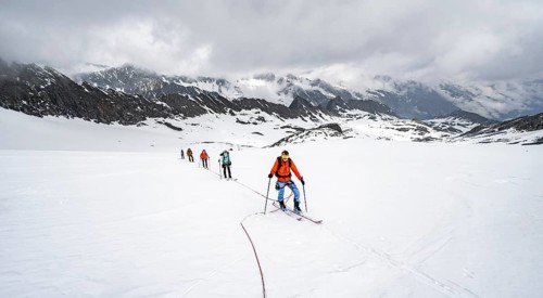 Ski tourers ascending the rope