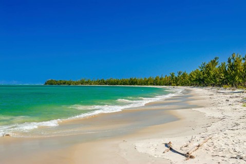 Long white sand beach in the east of the island Ile Sainte-Marie although Nosy Boraha