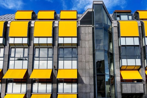 Facade of the Hypovereinsbank with yellow blinds