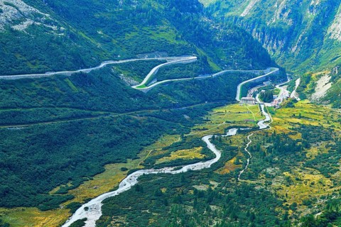 View from the Rhone glacier to the glacier stream and the pass road from Furka