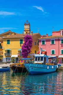 Boats anchor in the harbour of Porto Azzurro