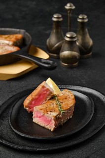 Roasted tuna steak medium rare on a plate