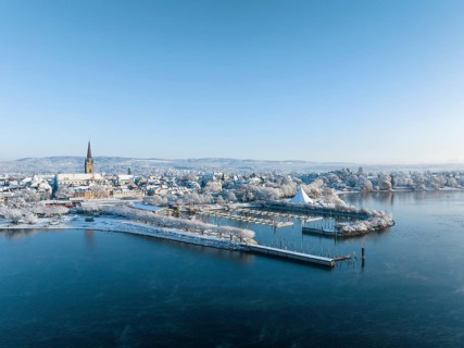 Aerial view of the town of Radolfzell on Lake Constance in winter with the harbour pier and Waeschbruckhafen
